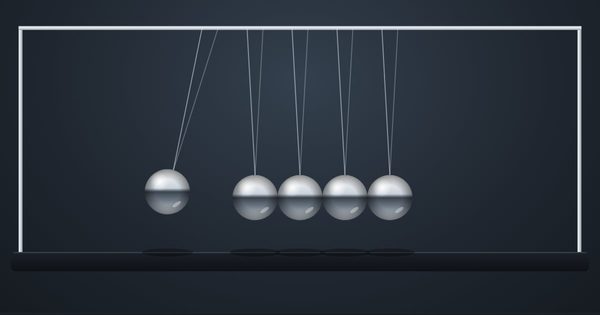A chrome Newton's cradle with one ball swinging out